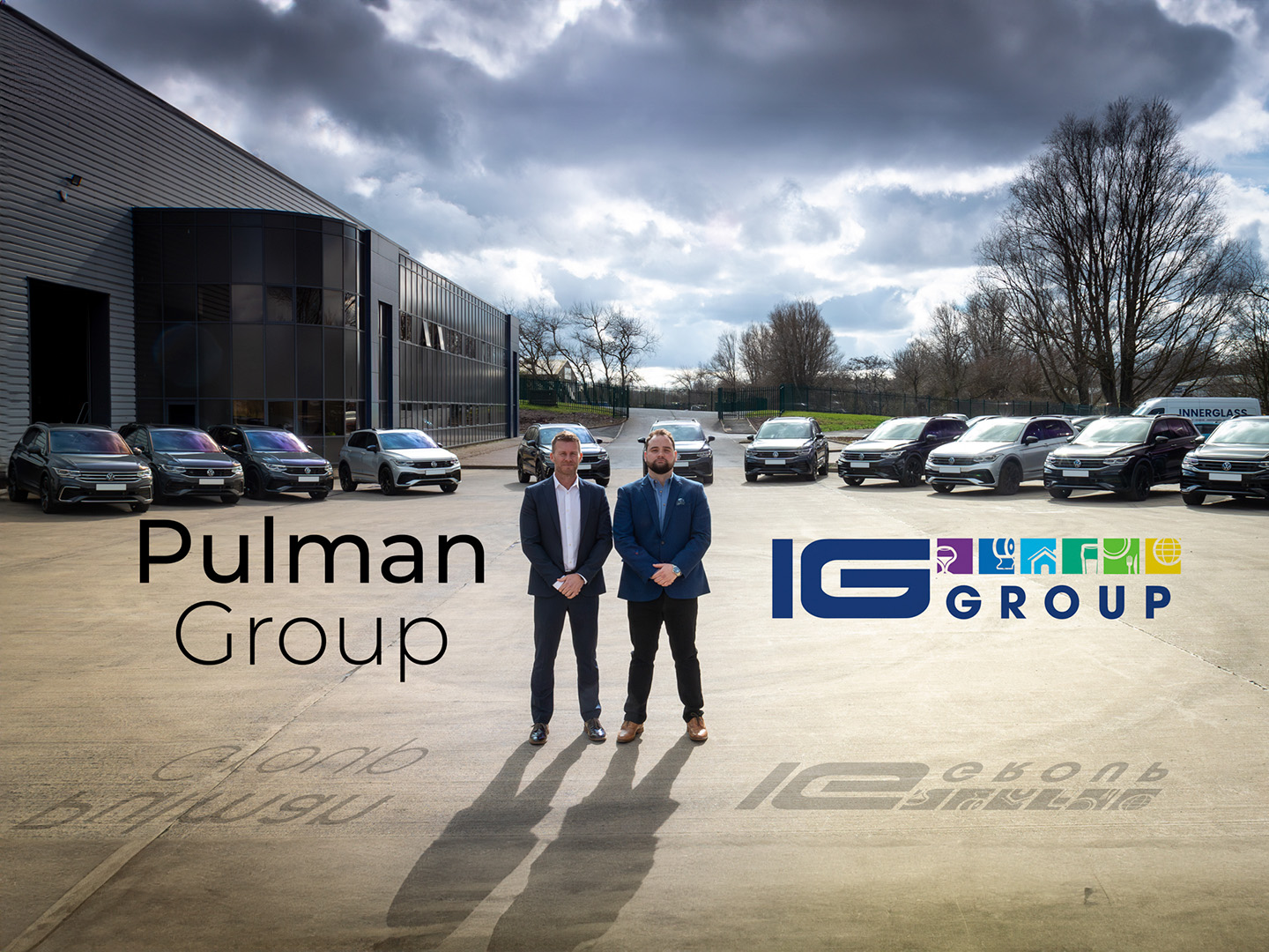 Pulman and IG Group representatives with their Volkswagen Tiguan fleet