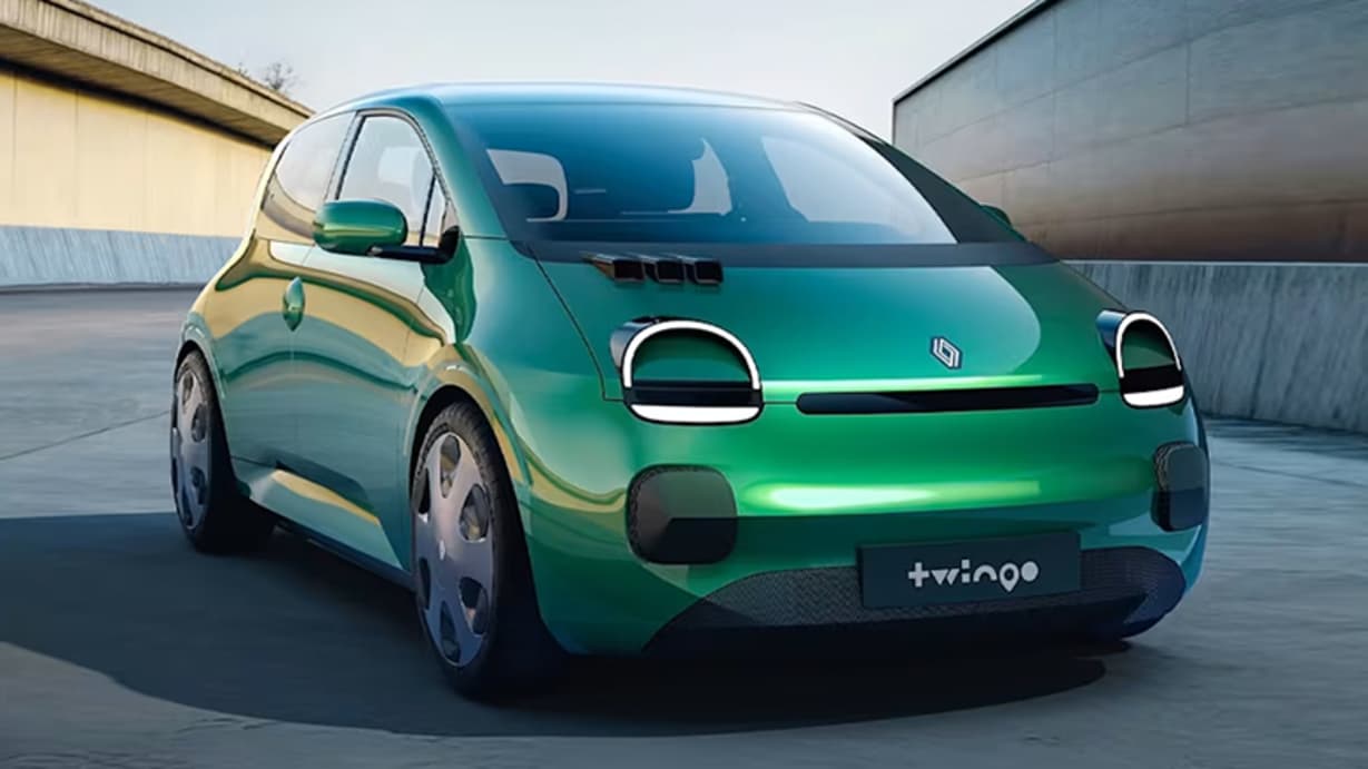 A modern green Renault Twingo electric car parked on a smooth surface with a minimalist background.