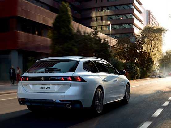 Peugeot 508 SW on a city road