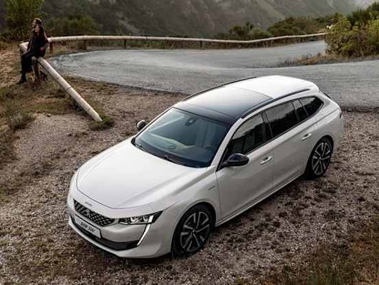 Peugeot 508 SW at the side of a mountain road