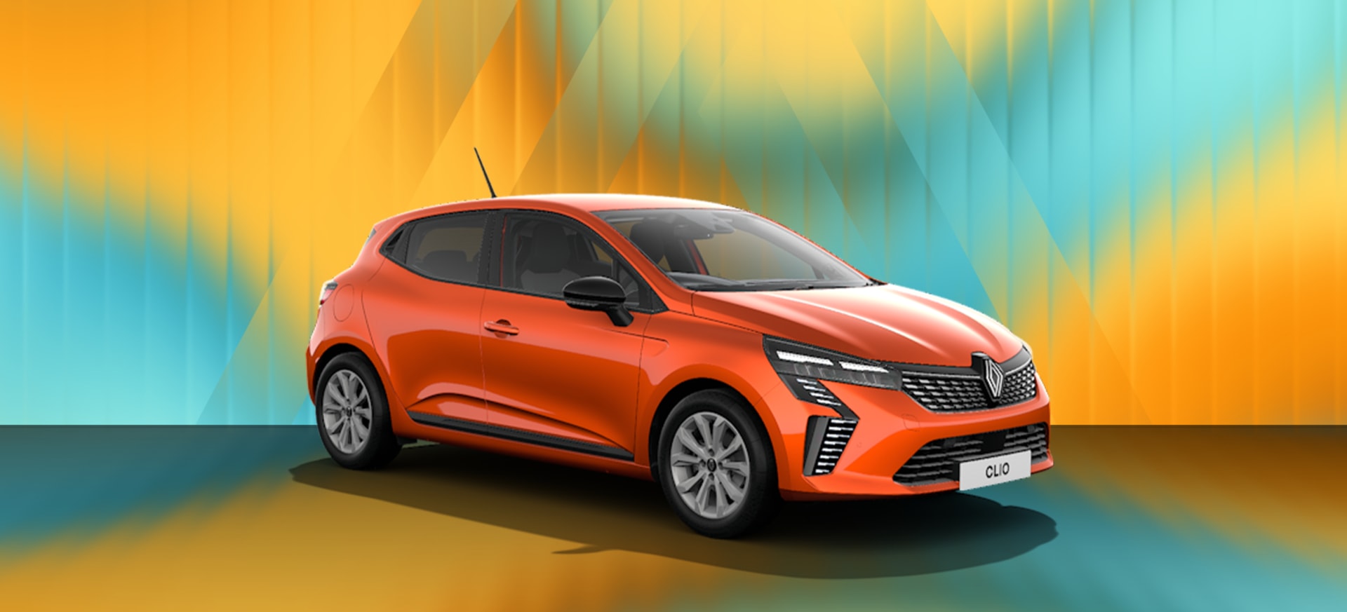 A vibrant orange Renault Clio displayed against a colourful gradient background.