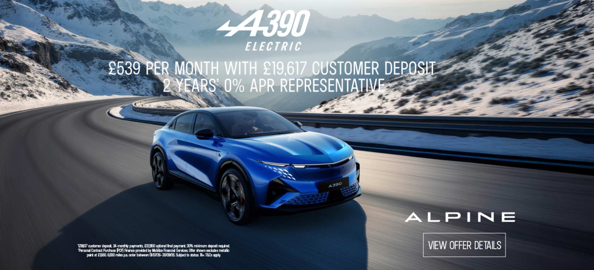 a sleek modern ALPINE A390 Electric Coupe in Blue driving through snowy mountains