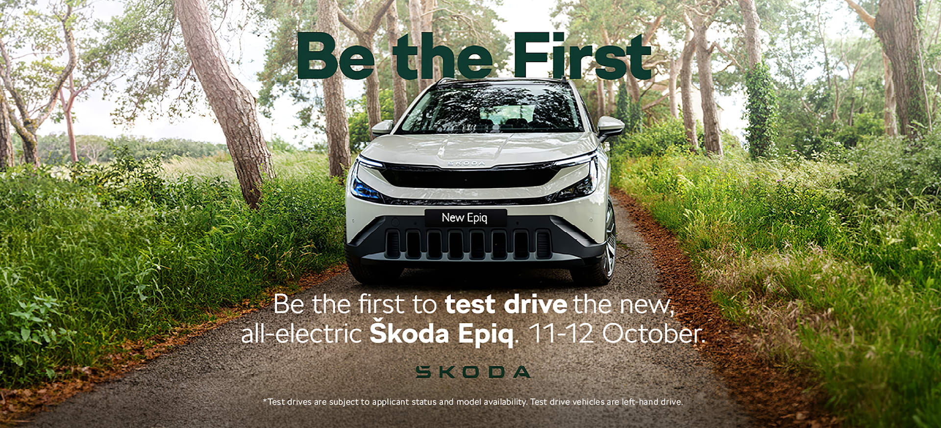 A white Škoda Epiq parked on a forest path, surrounded by trees, promoting a test drive event.