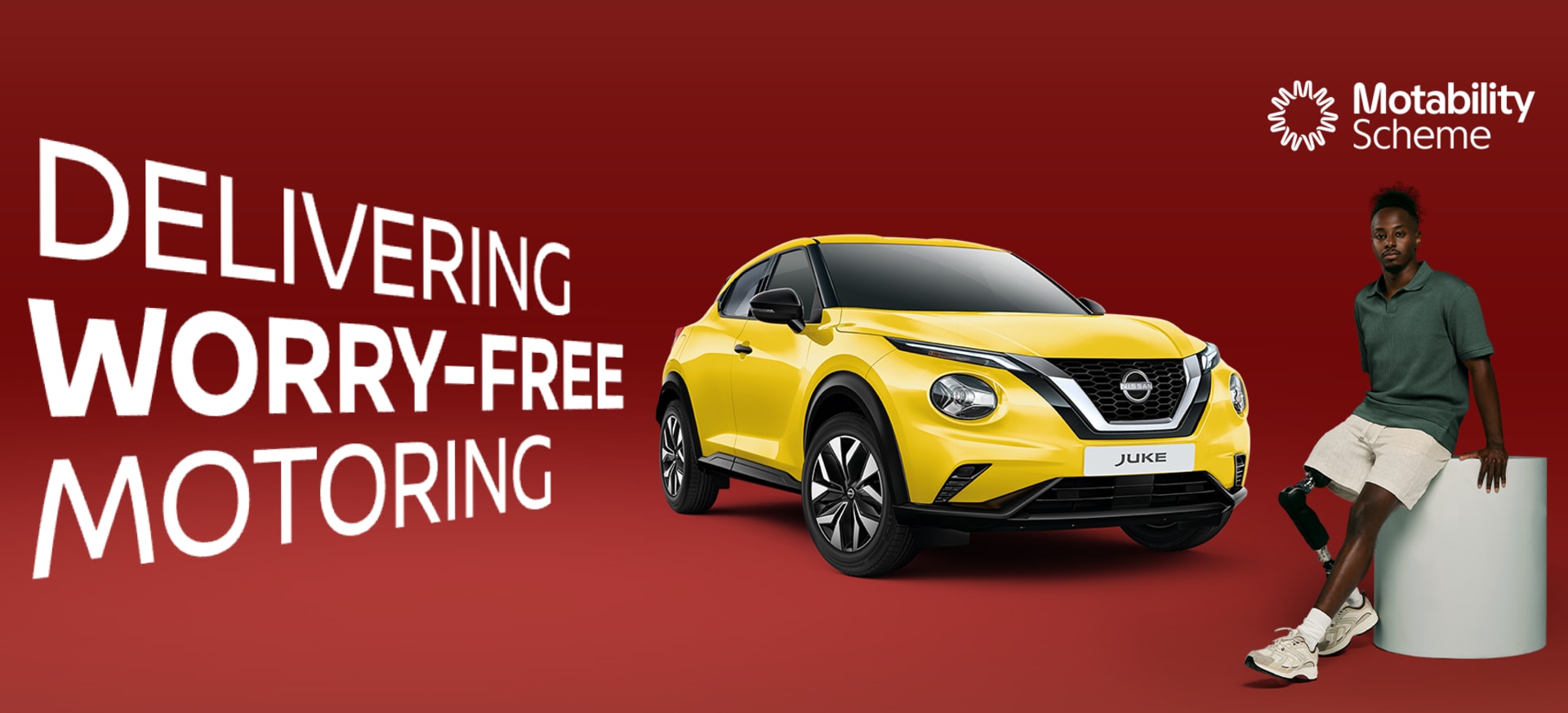 A yellow Nissan Juke parked beside a person sitting on a pedestal, with text promoting worry-free motoring.
