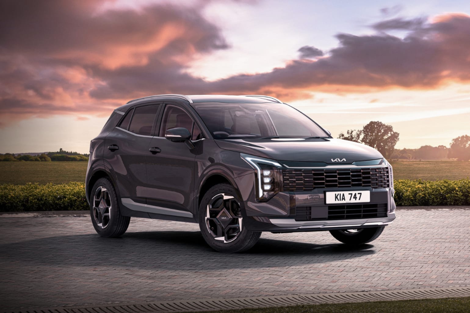 New Kia Sportage Storm parked outside Westdrive Kia Braintree showing the gloss black grille and 18-inch alloy wheels