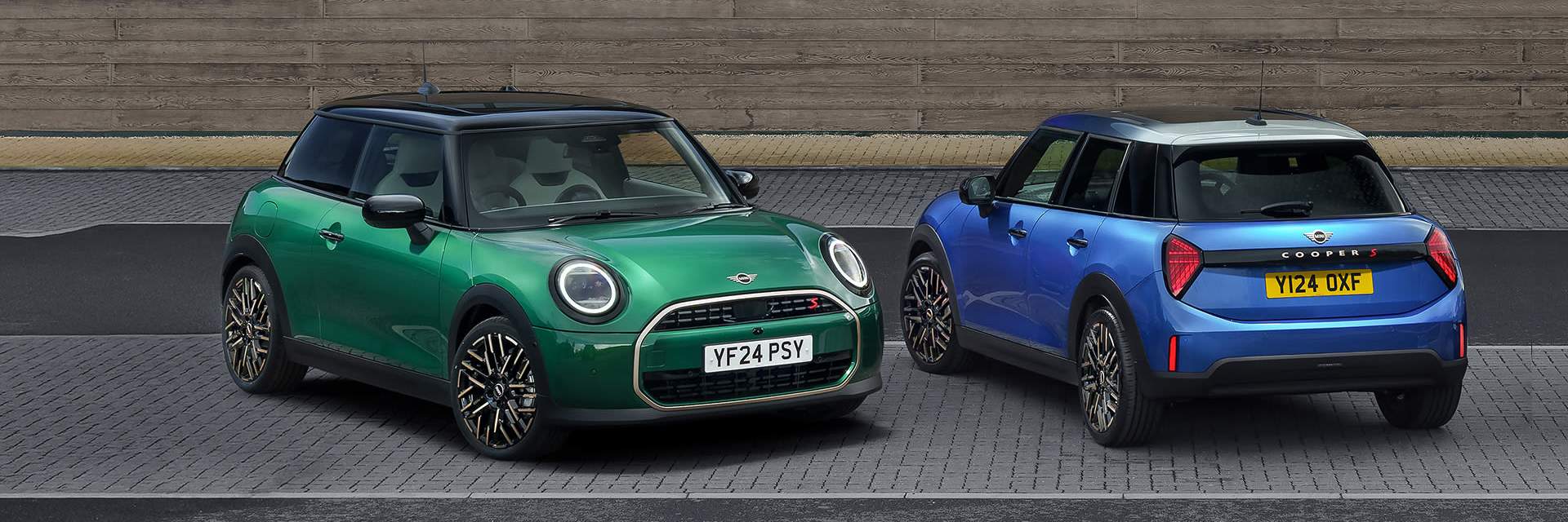 MINI Copper models pictured by a wall