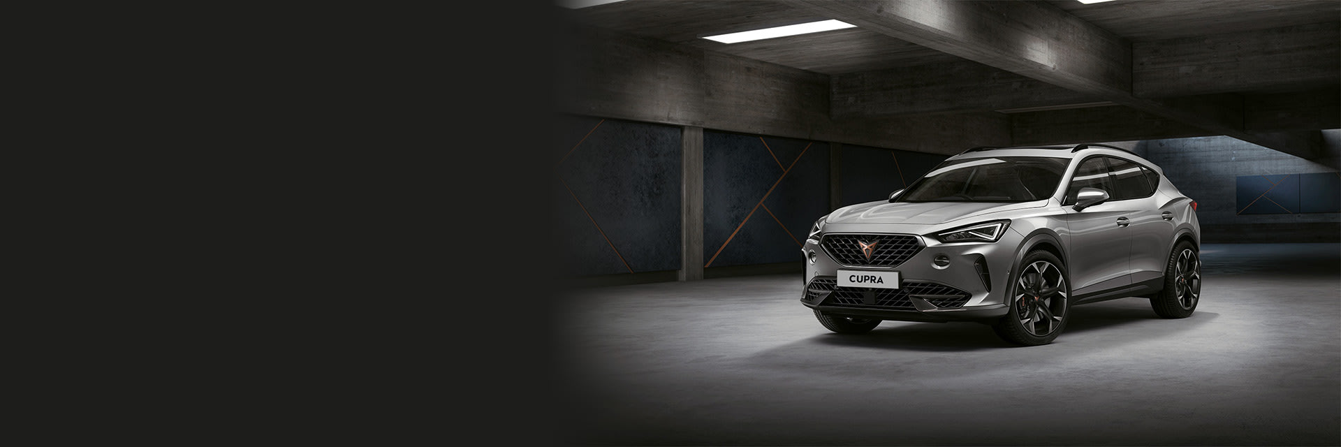 Lifestyle CUPRA Formentor front side view in spotlight image.