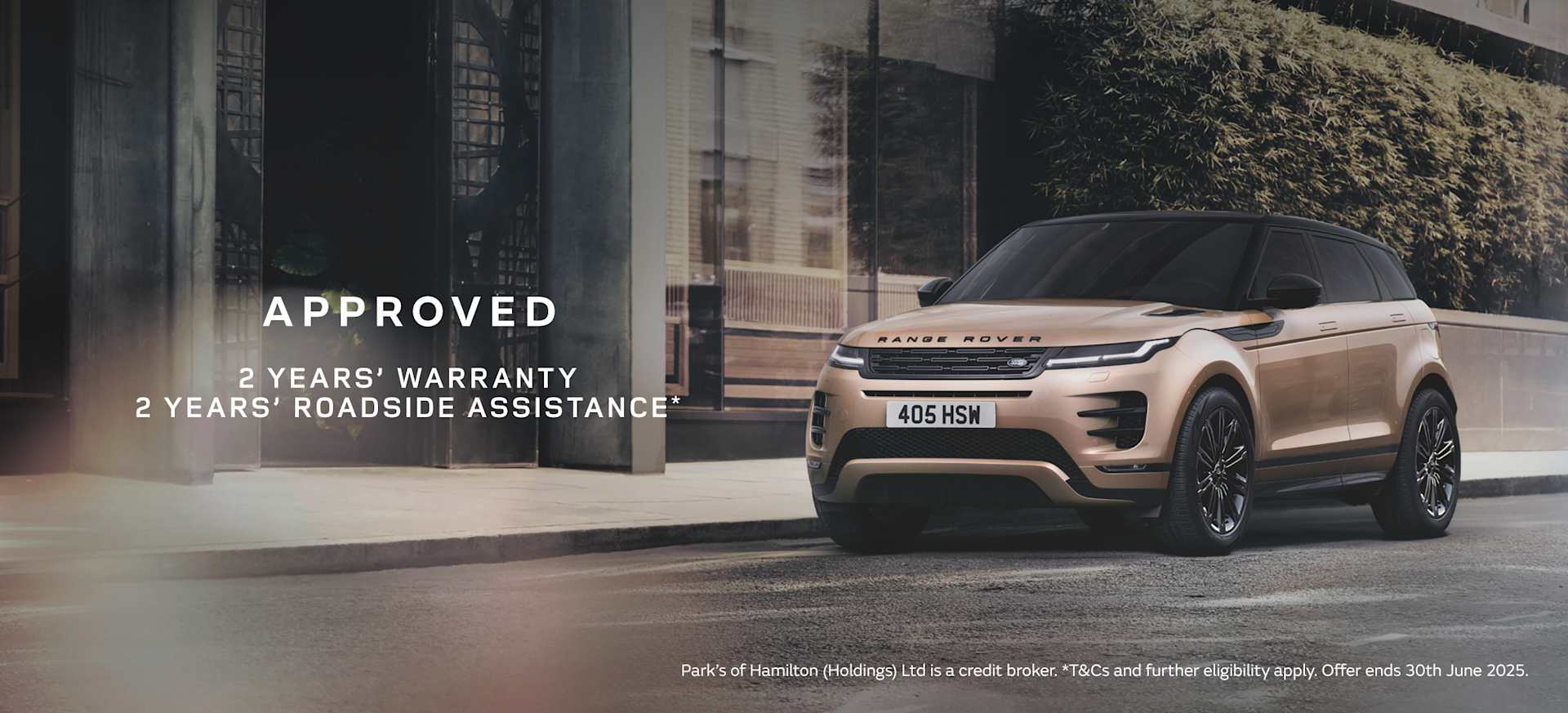 A sleek Range Rover Evoque parked in an urban setting, highlighting warranty and assistance offers.