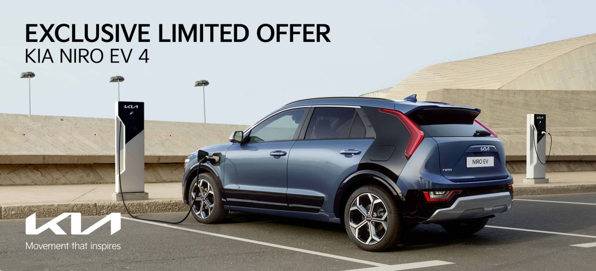 A Kia Niro EV 4 charging at a station, showcasing its sleek design against a modern backdrop.