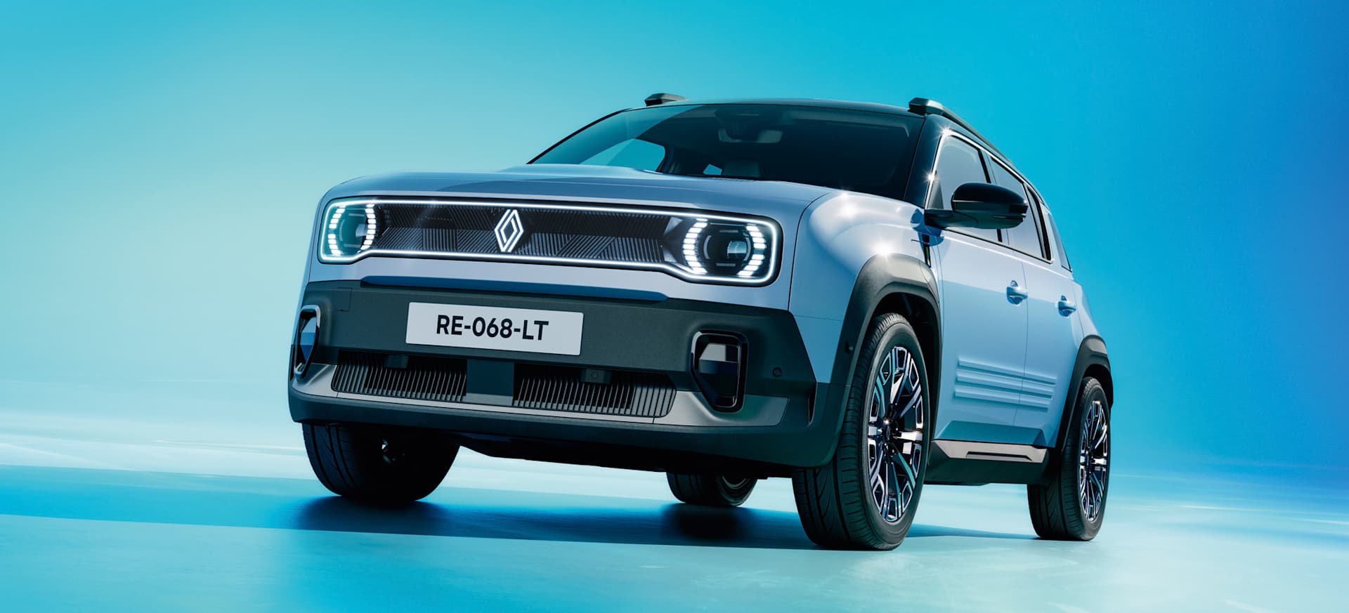 The award-winning Renault 4 in grey with distinctive headlights, set against a blue background.