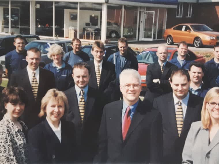 Archive TMS team photograph outside a Volvo retailer
