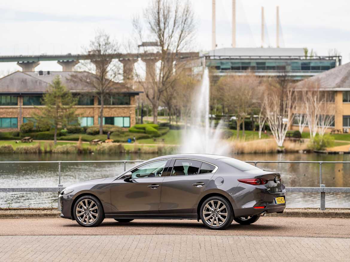 Mazda3 Saloon — premium dark grey cloth interior dashboard cabin