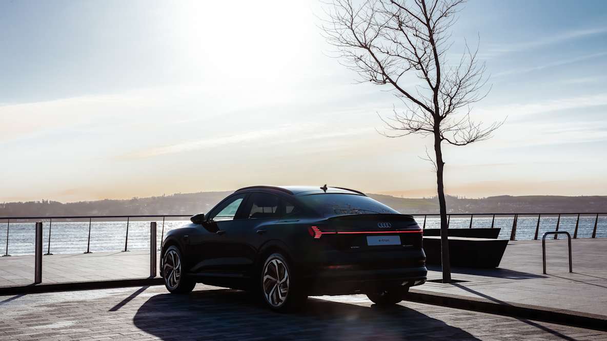 Black Audi E-tron shot from behind overlooking the River Tay