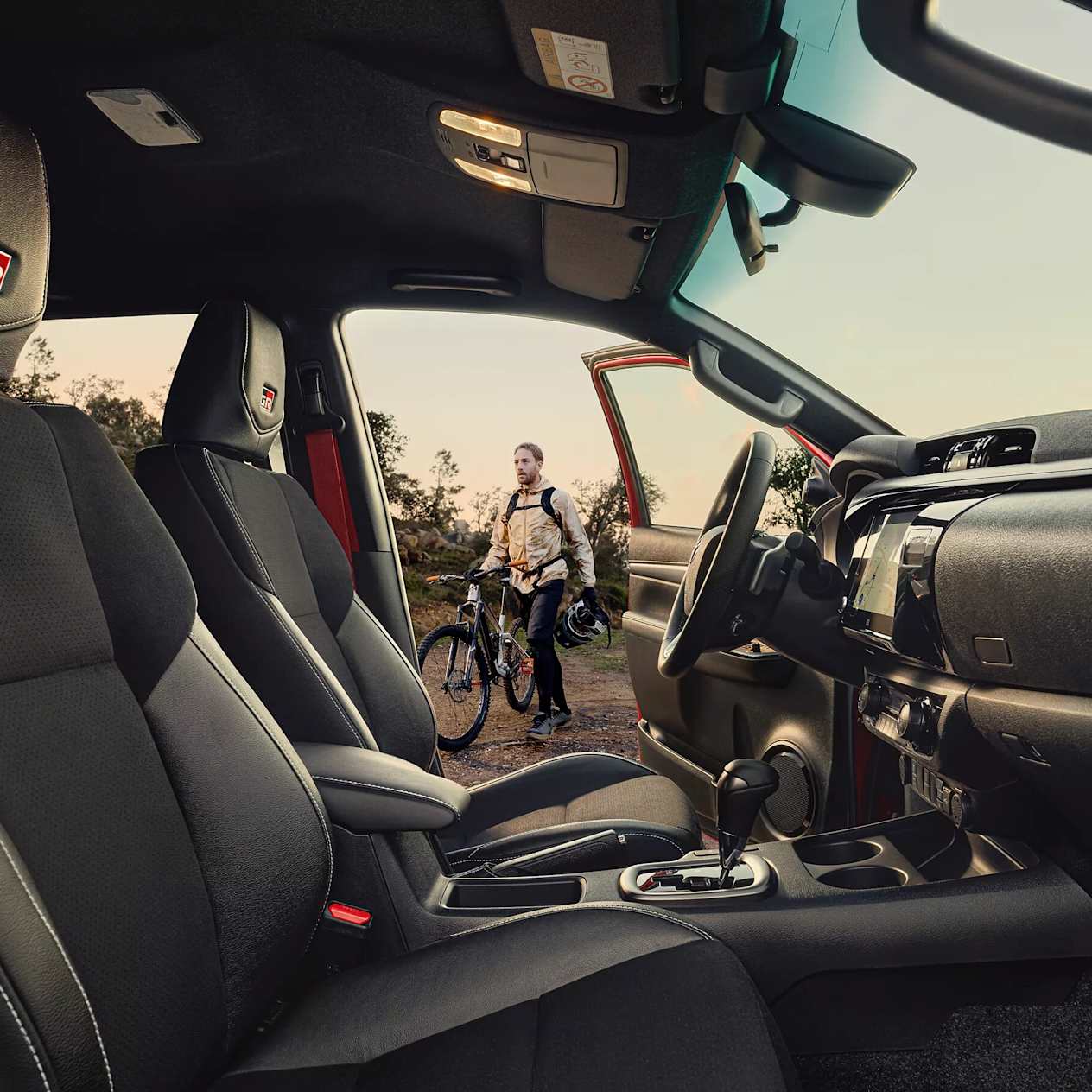 New Hilux & Man with Bike