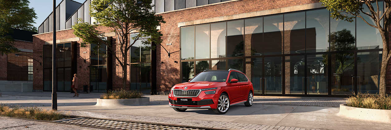 ŠKODA  car outside large house