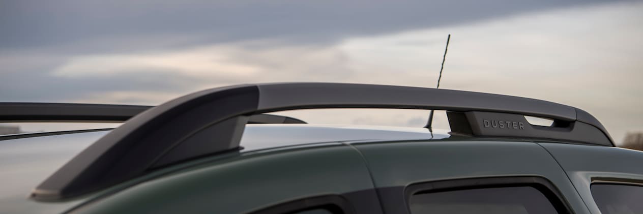 Close up of the roof bars on a green Dacia Duster