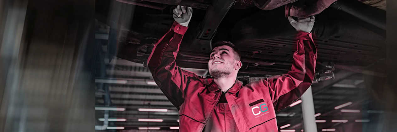 Croxdale Service Technician wearing red overalls with the new white and Green Croxdale Logo lettering