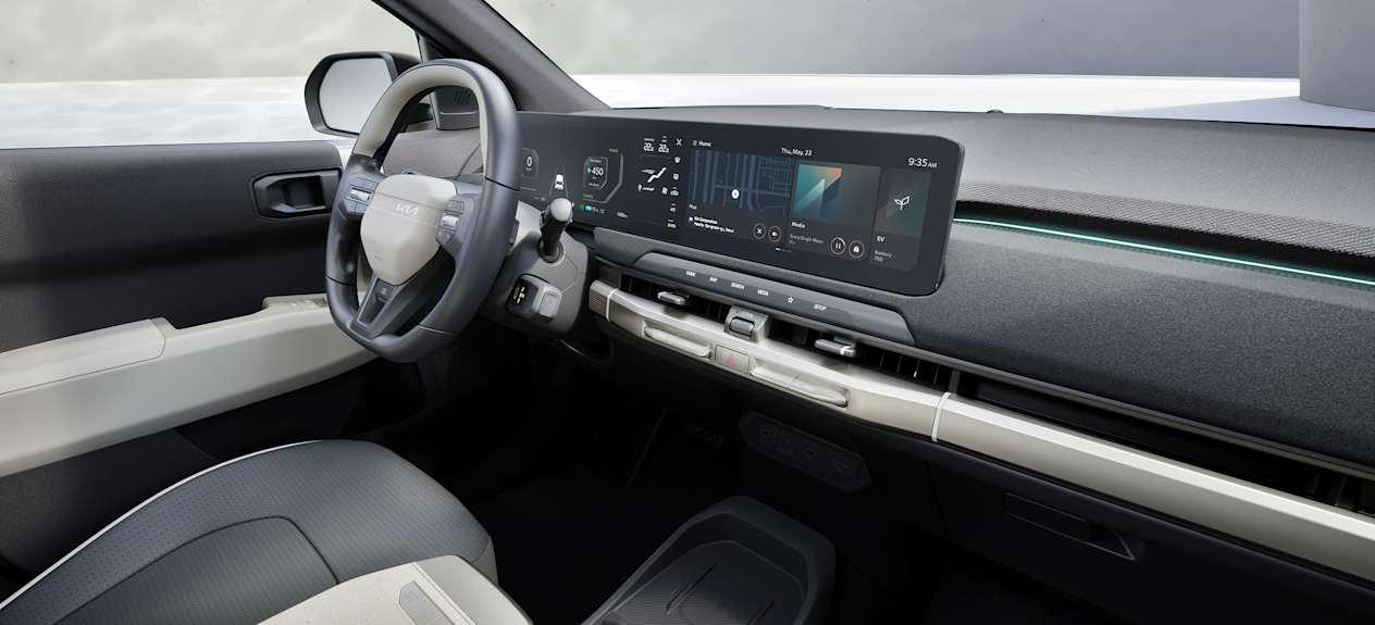 Kia EV3 2025 : planche de bord et écrans vus du siège passager avant