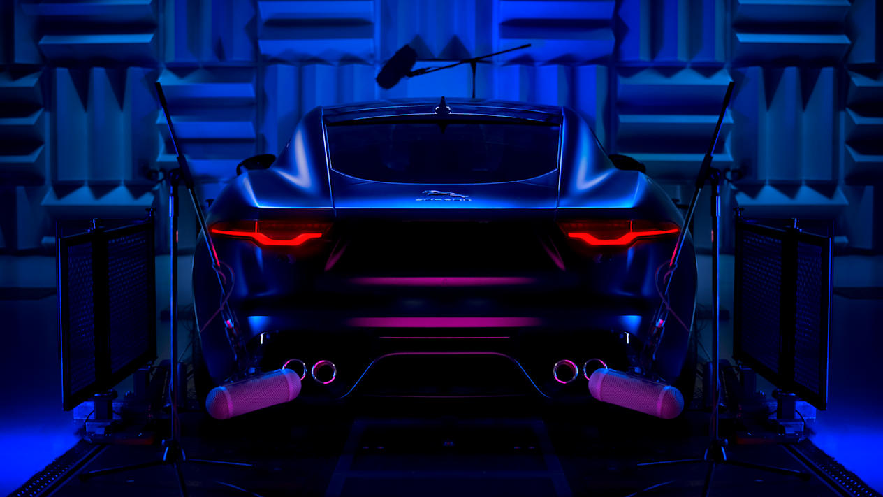 A backlit rear view of the Jaguar F-TYPE being recorded