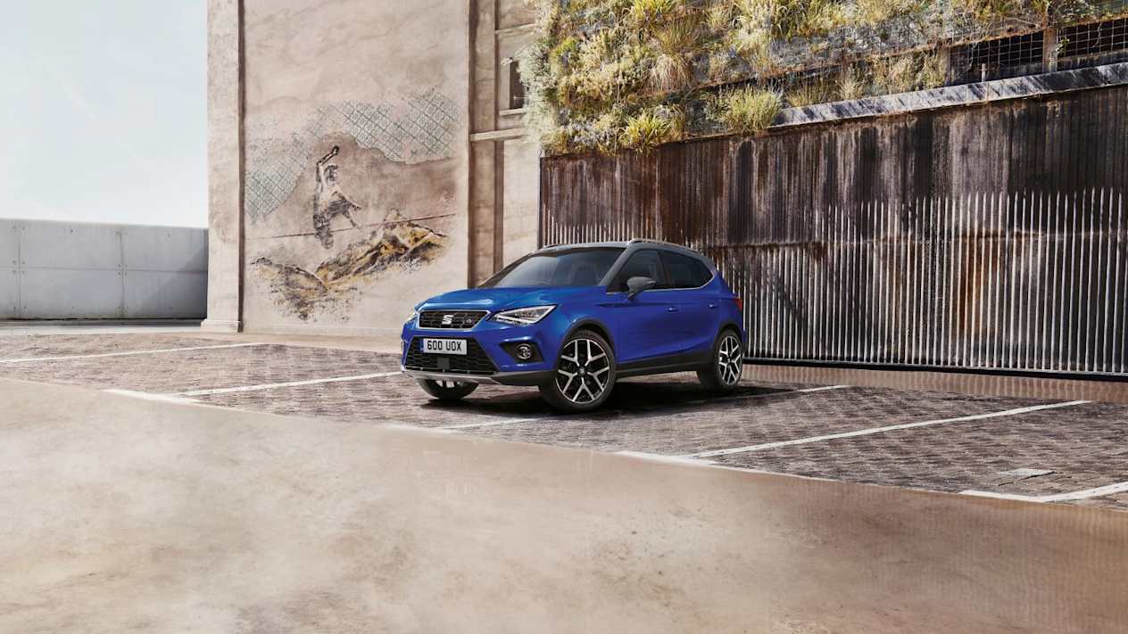 A blue SEAT Arona parked