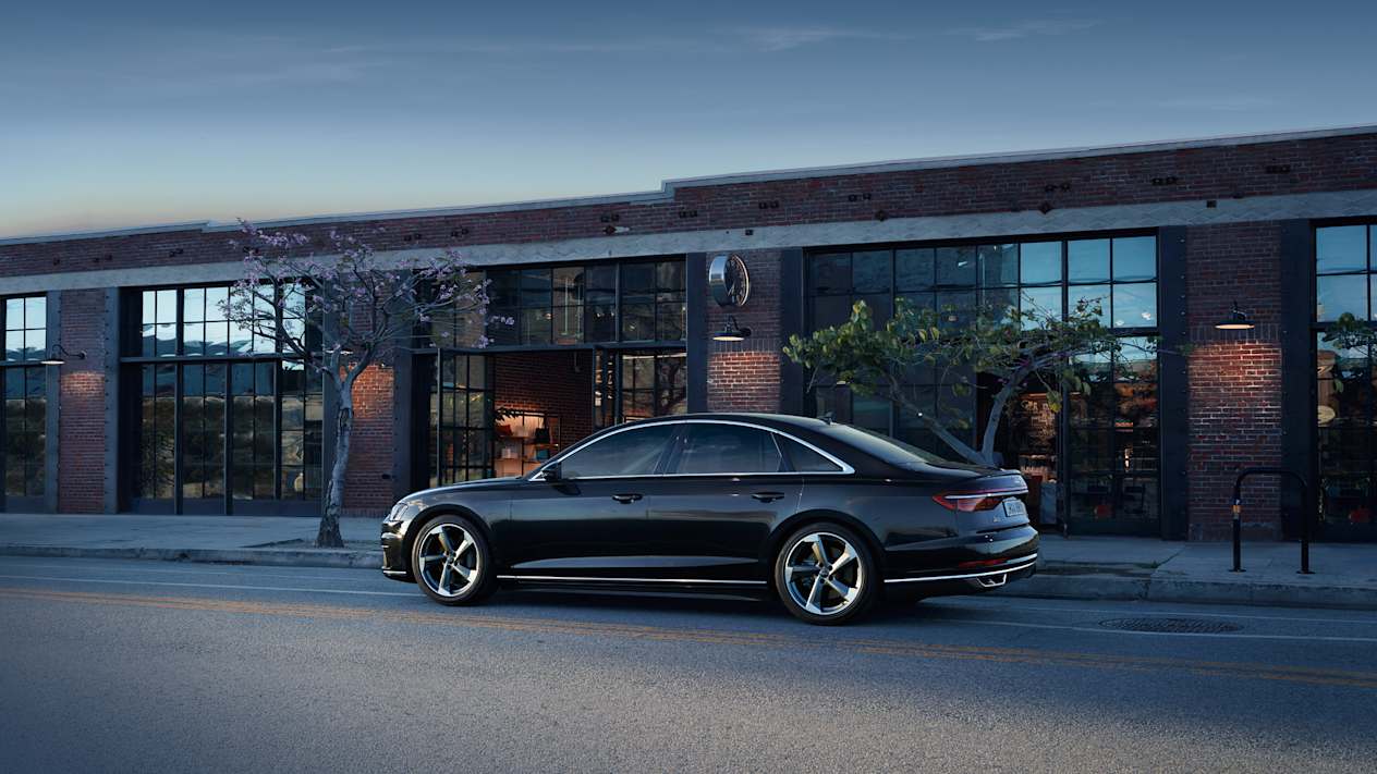 Audi A8 in Terra Gray Metallic parked outside shop
