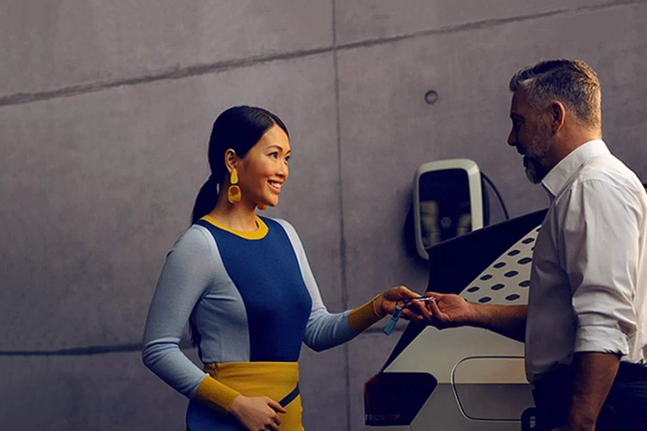 person handing over a car to a customer