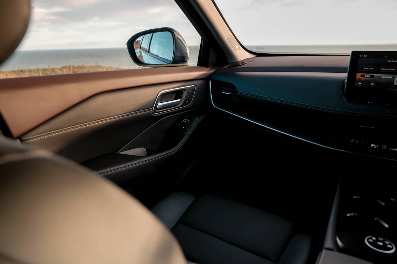 The front passenger seat and space inside the Nissan X-Trail