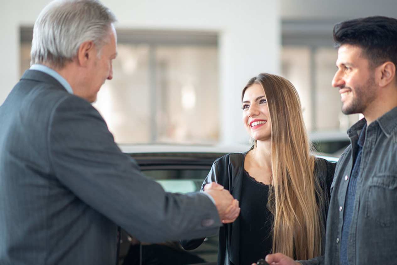 Customers talking to sales man 