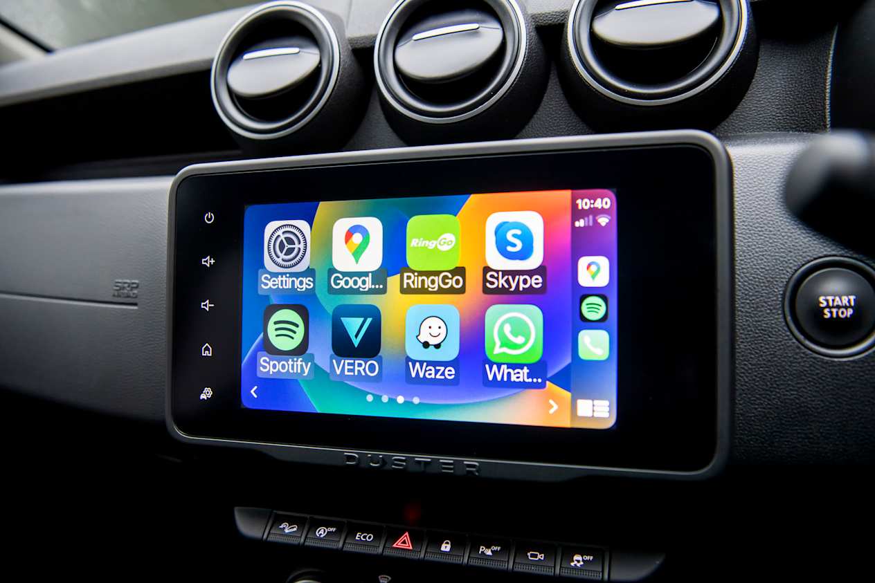 Close up of the infotainment screen in the Dacia Duster with air conditioning vents above