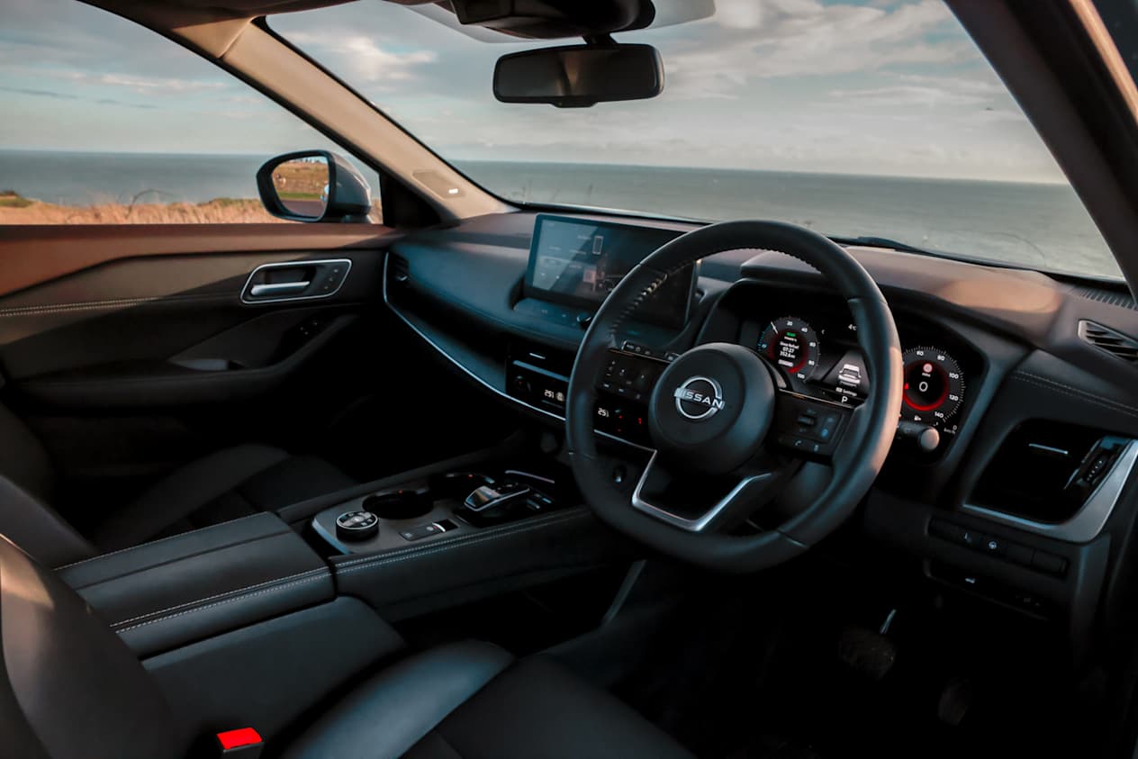 Interior view of the Nissan X-Trail from the driver side showing all controls