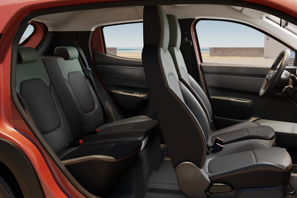 Side view fo the interior of the Dacia Spring showing all four seats