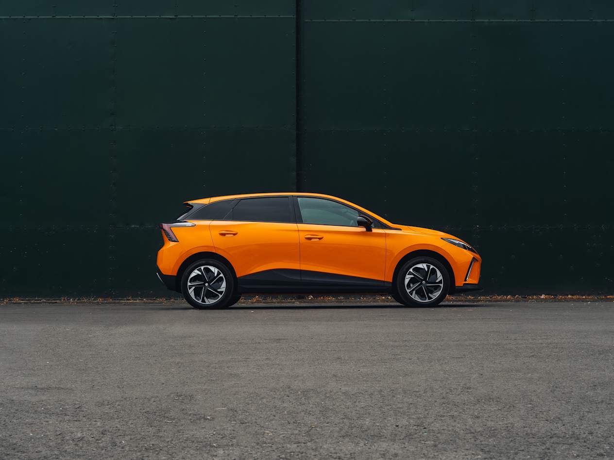 Side of a parked Orange MG4 EV