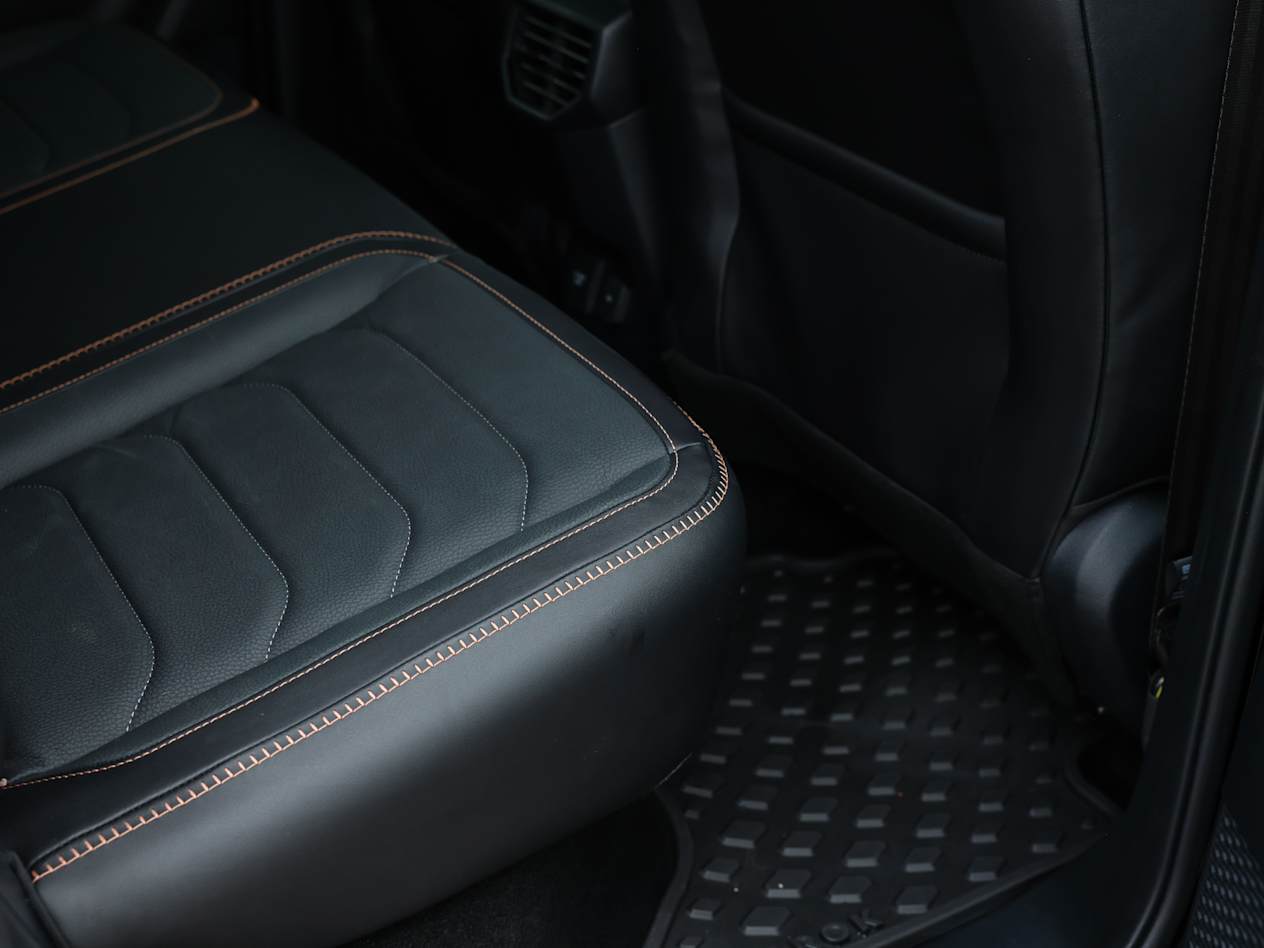 Close up of the rear seats of the Volkswagen Amarok finished in leather with contrast brown stitching