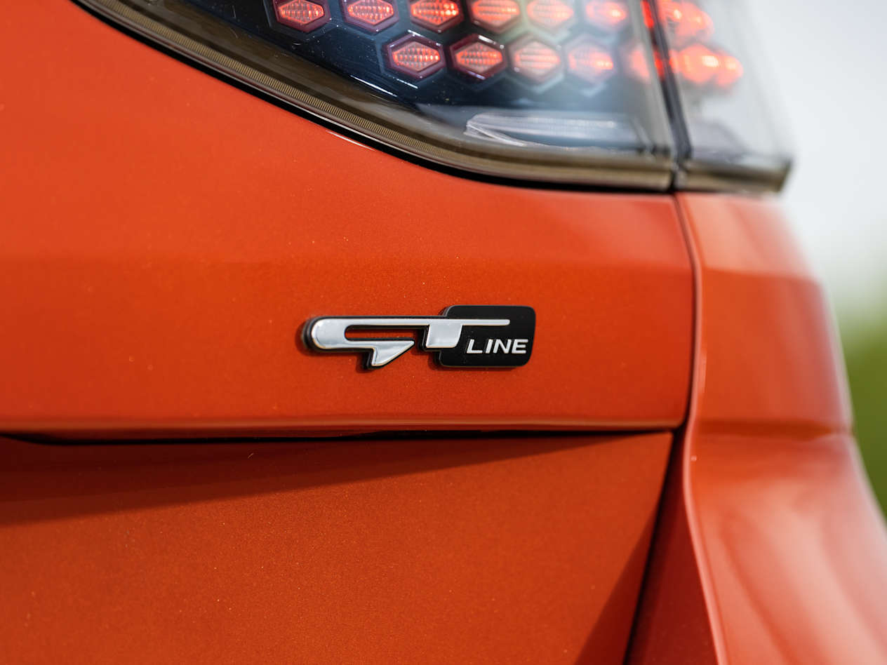 close up on the GT-Line badge on an orange Kia Ceed