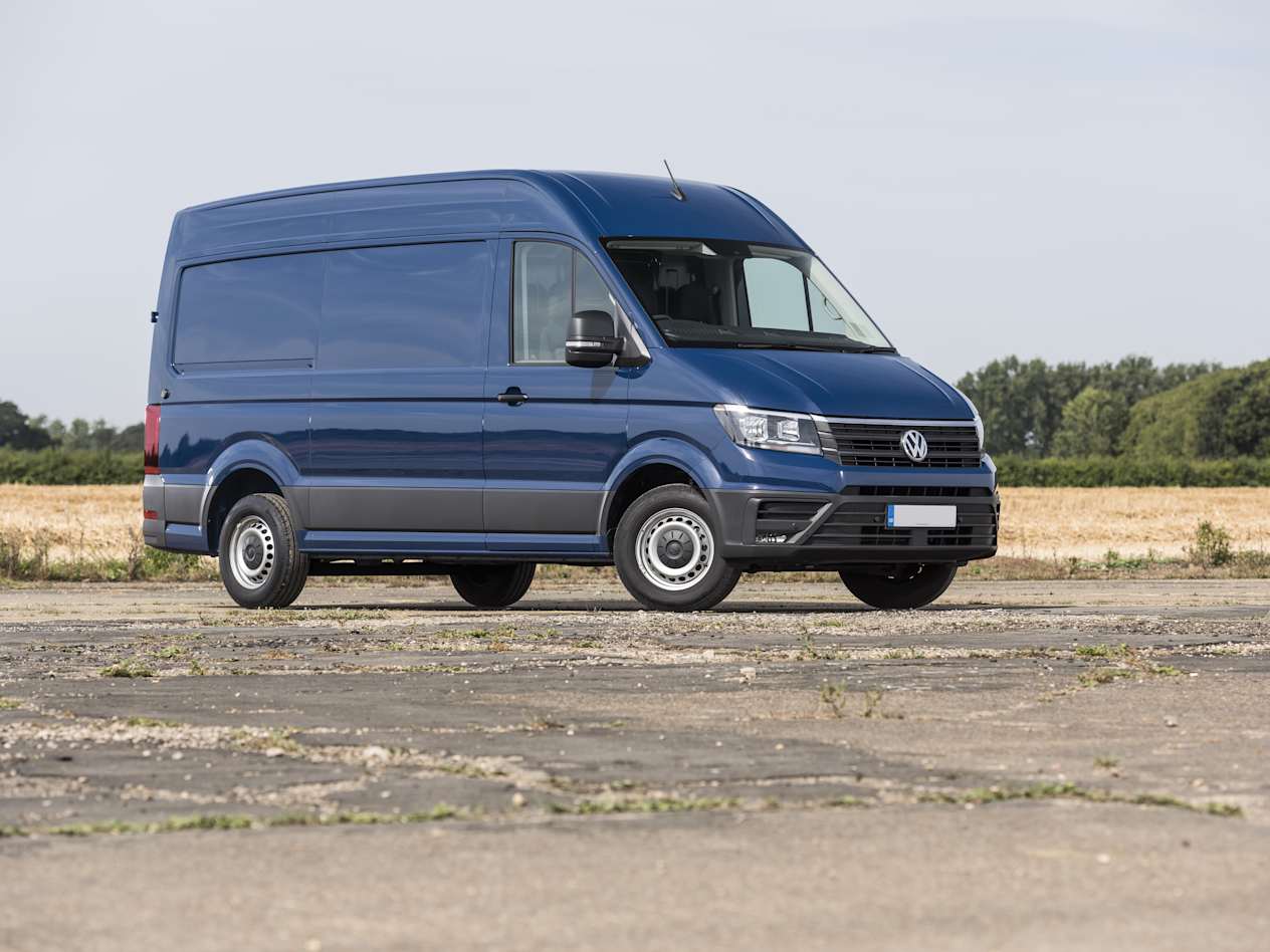 A blue Volkswagen Crafter parked in an open paved area