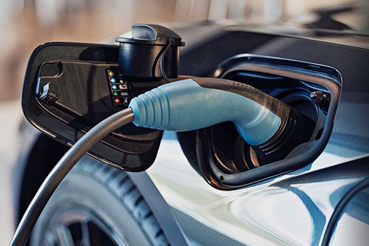 Close up of an EV charge cable plugged into an EV