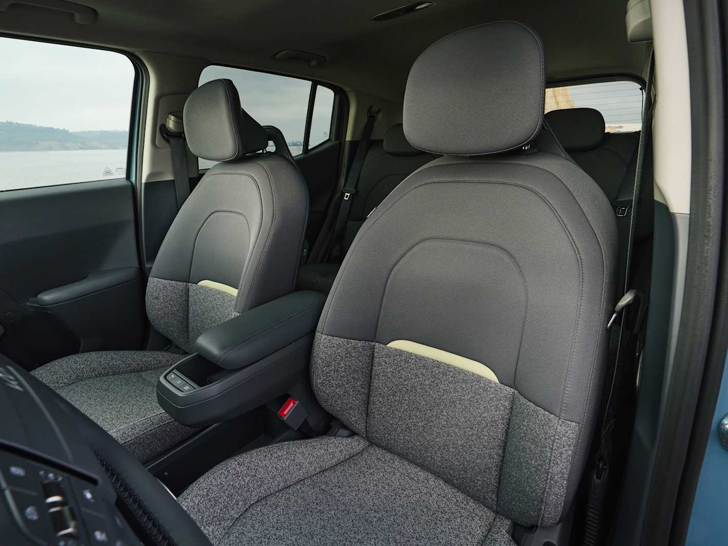 Kia EV2 interior showing the dual 12.3-inch Navigation Cockpit screens and climate touchscreen