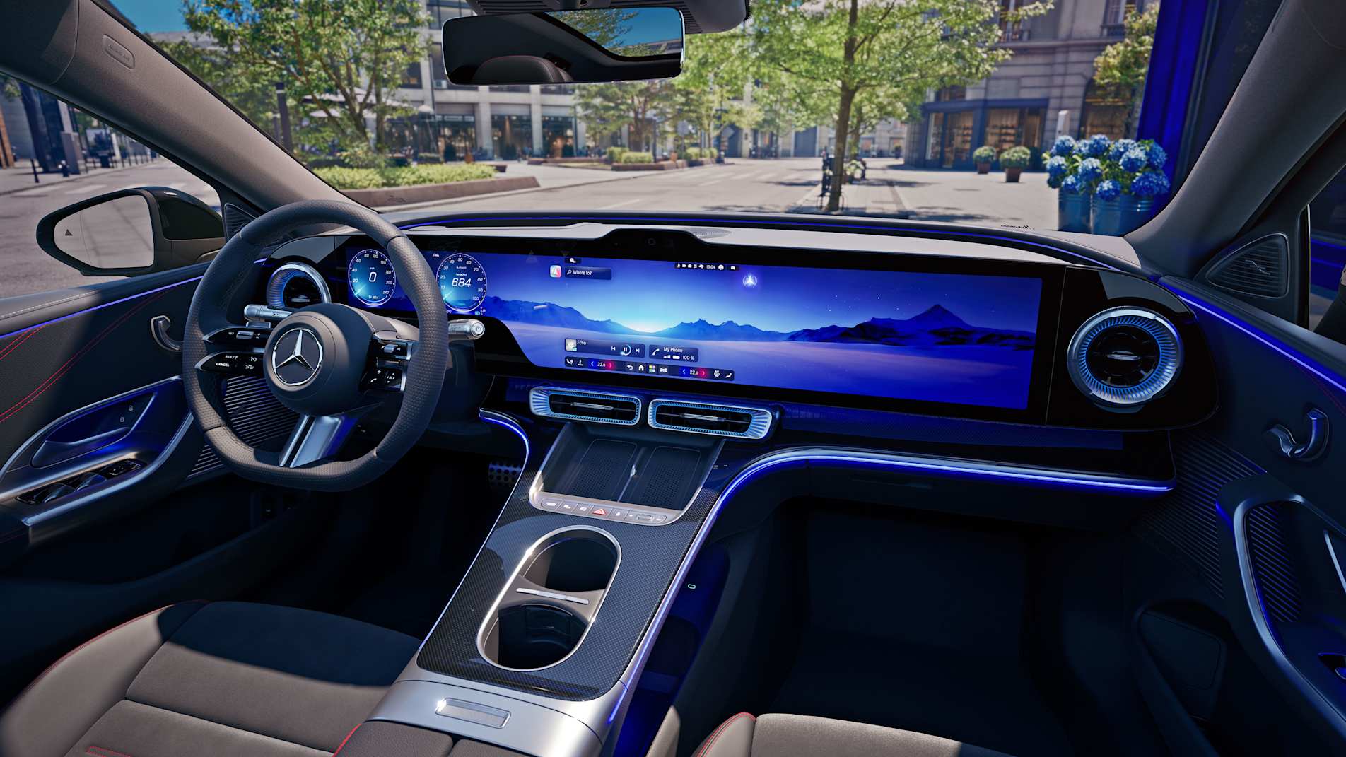 All-new electric Mercedes-Benz C-Class interior with a widescreen display and blue ambient lighting