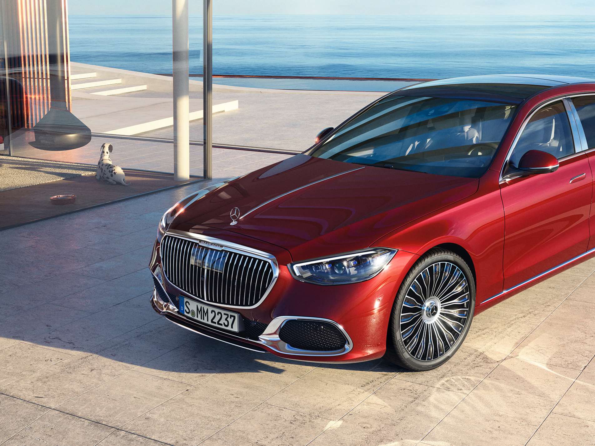 Red Mercedes-Maybach S-Class parked beside the sea