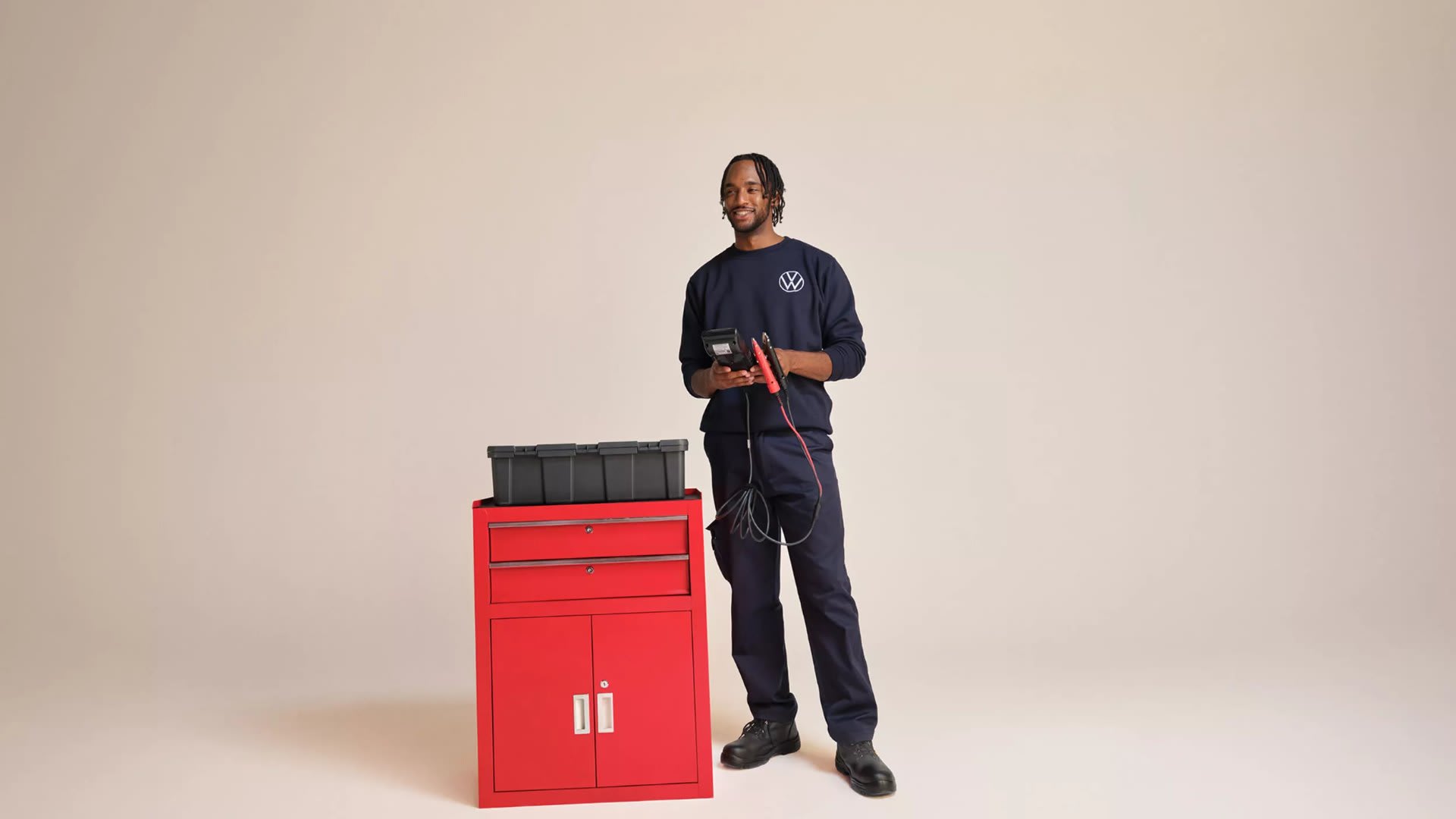 Volkswagen service technician beside a red tool cabinet – why book with Camerons Volkswagen, Perth