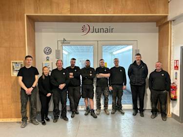 Cameron Motor Group bodyshop team standing outside the paint booth