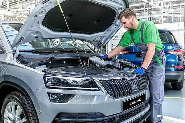 Škoda-trained technician servicing a Škoda Karoq at a West End Garage Škoda service centre