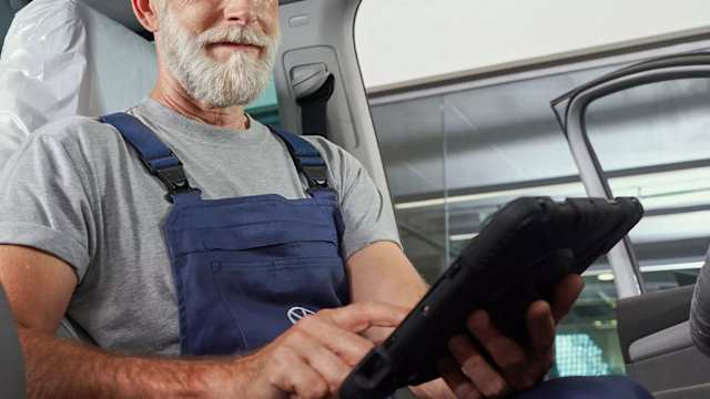 Volkswagen technician reviewing a service checklist on a tablet – Camerons Volkswagen, Perth