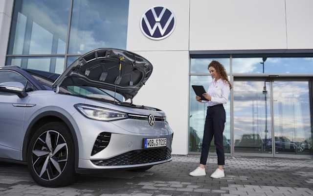 Volkswagen technician inspecting the air conditioning system – air conditioning service at Camerons Volkswagen, Perth