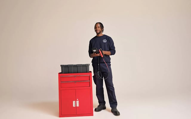 Volkswagen service technician beside a red tool cabinet – why book with Camerons Volkswagen, Perth