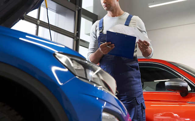 Volkswagen technician with a tablet in the workshop – Volkswagen service at Camerons Volkswagen, Perth