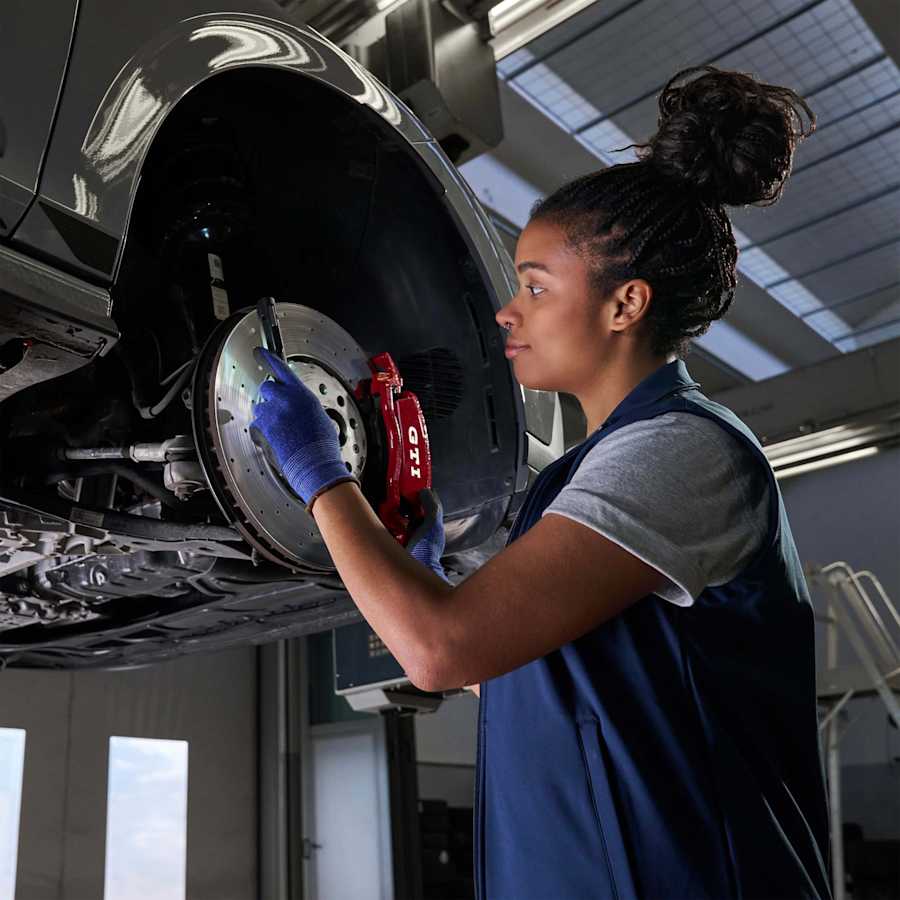 Volkswagen technician fitting genuine Volkswagen parts